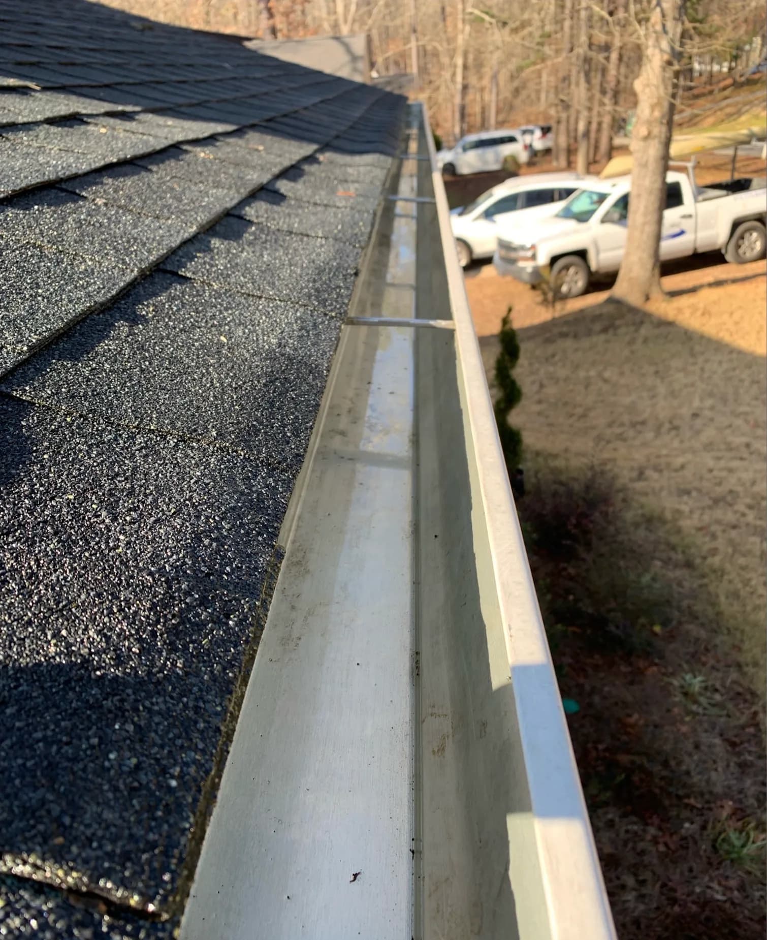 After: gutter cleaning with debris buildup and black tiger striping on a Richmond VA home