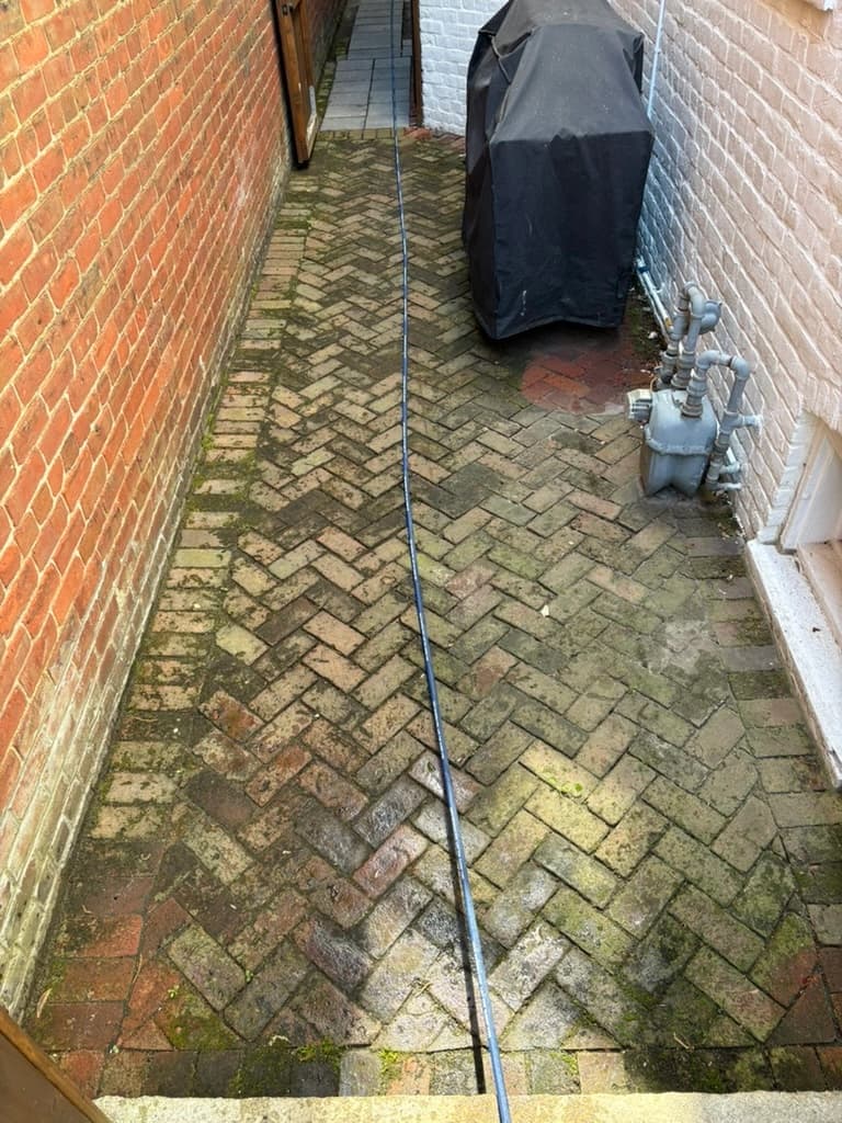 Before: brick patio and paver cleaning with algae and dirt buildup in Richmond VA